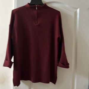 Mock neck sweater with cuff sleeves and side splits